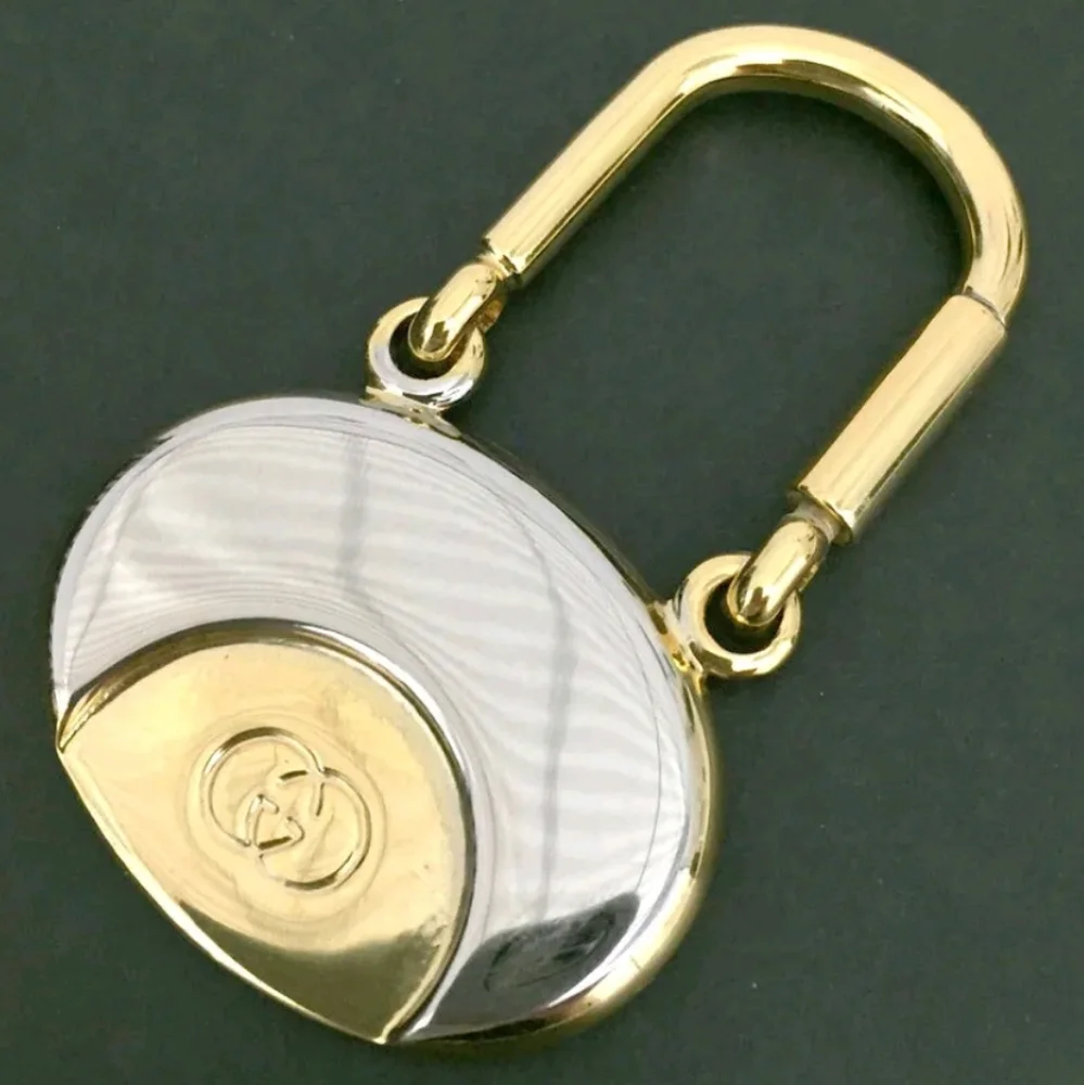 GUCCI INTERLOCKING G SILVER GOLD TONE KEY RING CHARM/UT1930 (UNISEX).